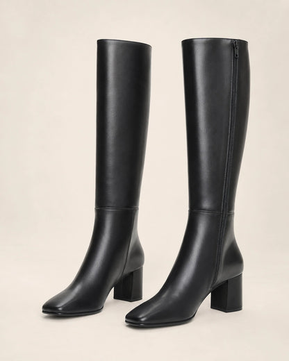 Women's black knee-high broad-heel boots, product-only pair.