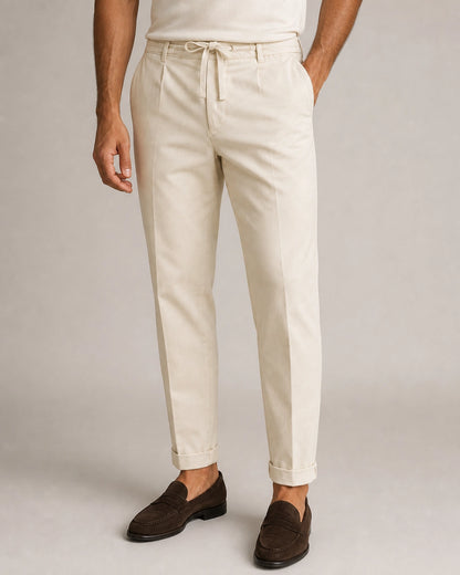 Men's beige relaxed elastic-waist summer pants, product-first front view.