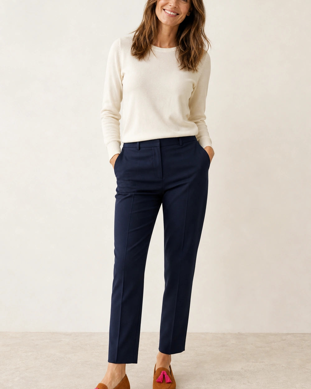 Women's Cognac Loafers with Pink Tassels — worn by a model