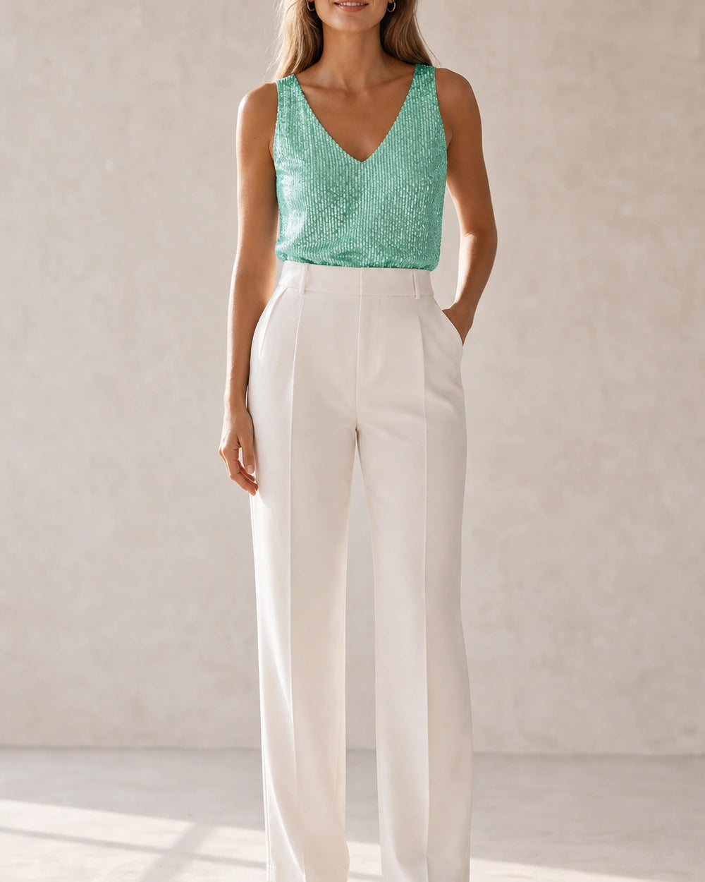 Women's green sequin V-neck tank top styled in a front view — momount-martha-sequin-top-green-02-styled-silhouette.webp