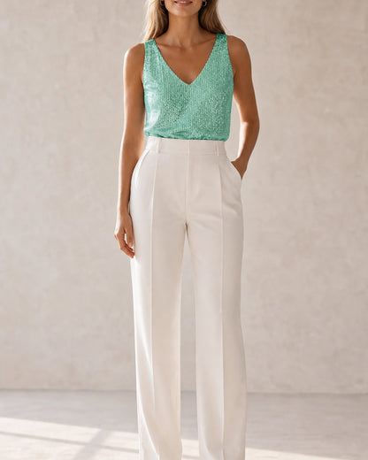 Women's green sequin V-neck tank top styled in a front view — momount-martha-sequin-top-green-02-styled-silhouette.webp