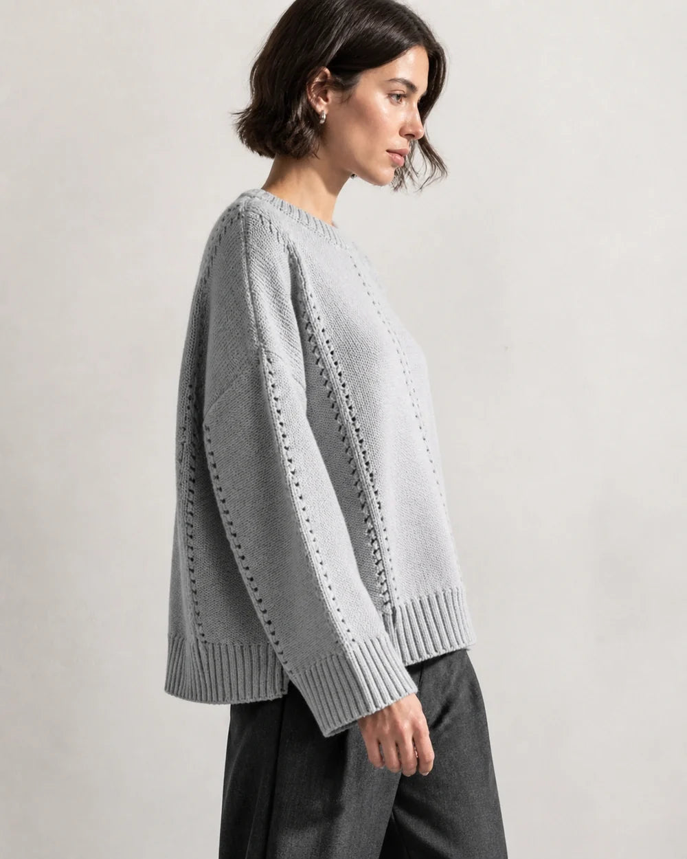 Grey oversized open-knit sweater for women, side view