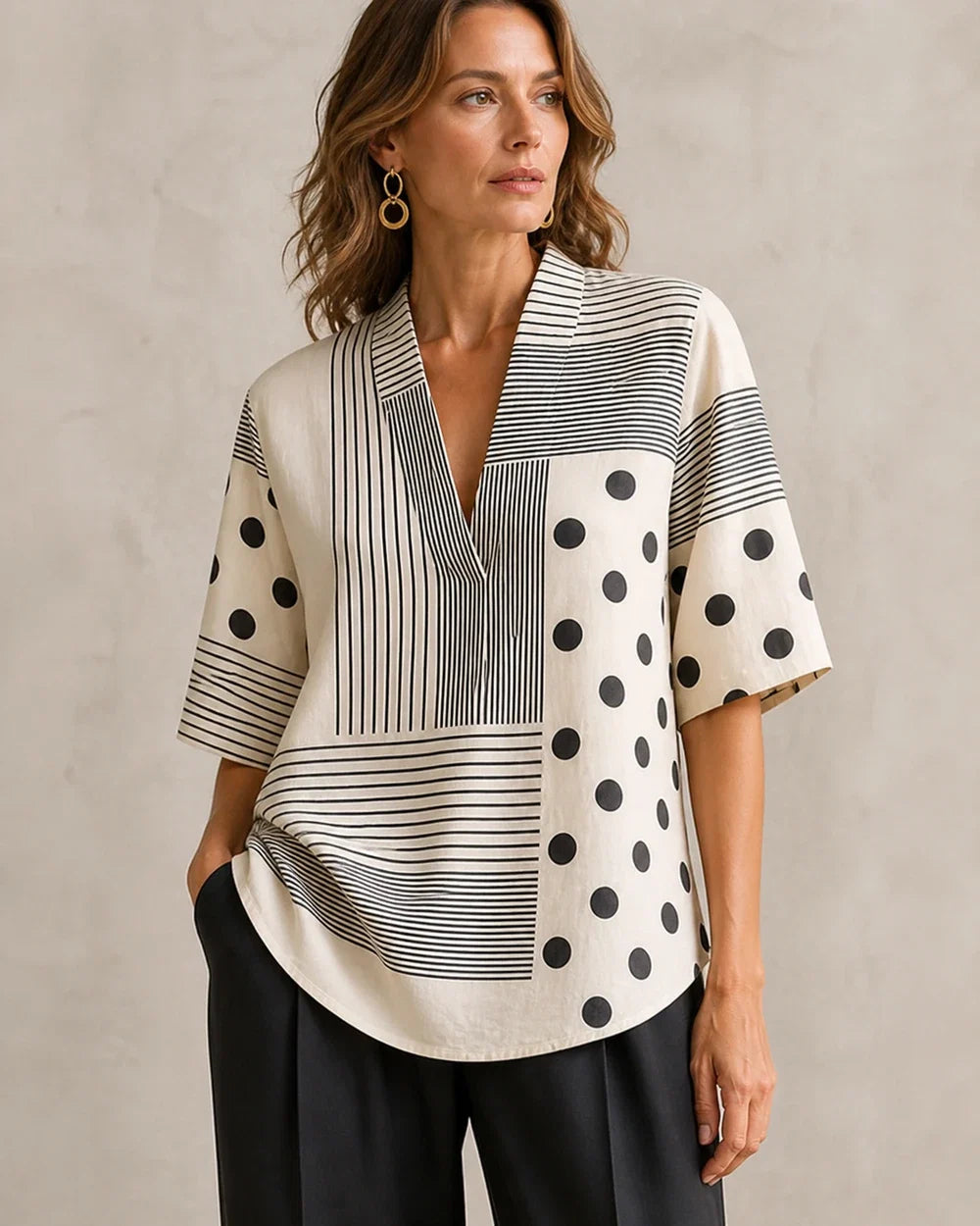 Women black and white striped polka-dot V-neck top hero