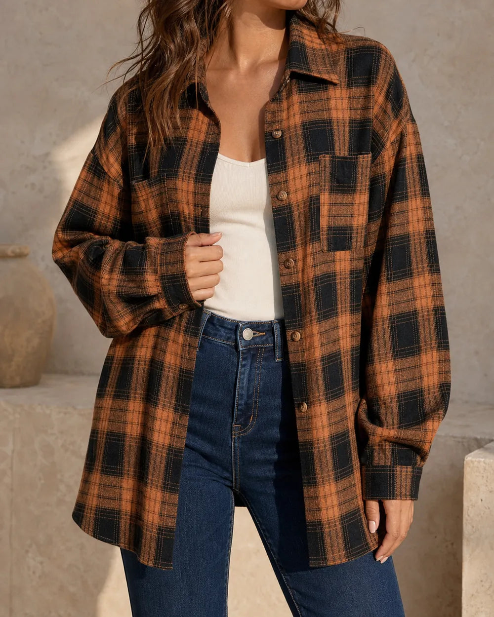 Women's caramel and black oversized plaid shirt, front three-quarter worn view. — momount-womens-oversized-plaid-shirt-caramel-01-hero.webp