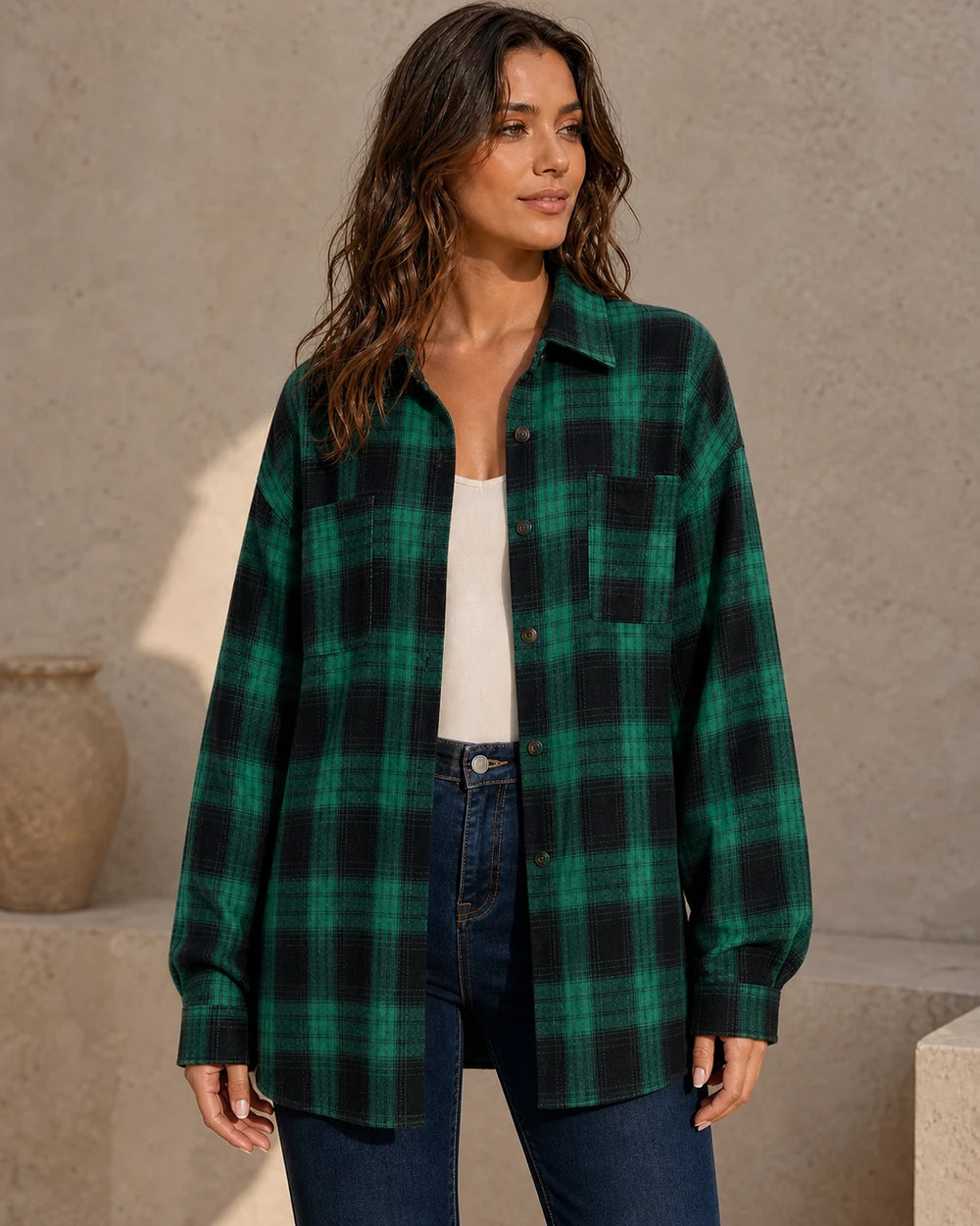 Women's dark green and black oversized plaid shirt, front three-quarter worn view. — momount-womens-oversized-plaid-shirt-dark-green-10-hero.webp