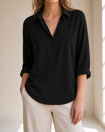 Women's black relaxed button-front blouse, front product view.
